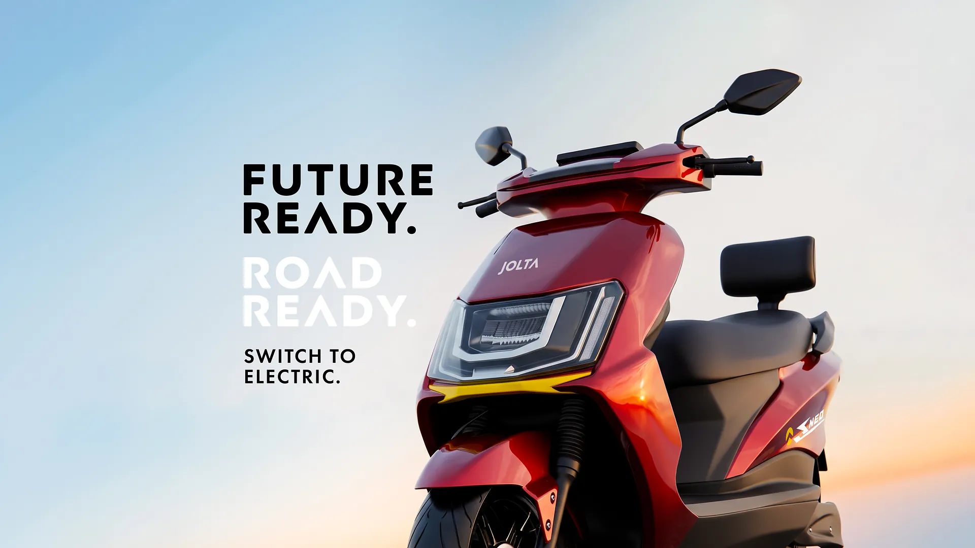 Red Jolta electric scooty against the sky. Future ready. Road ready. Switch to electric.