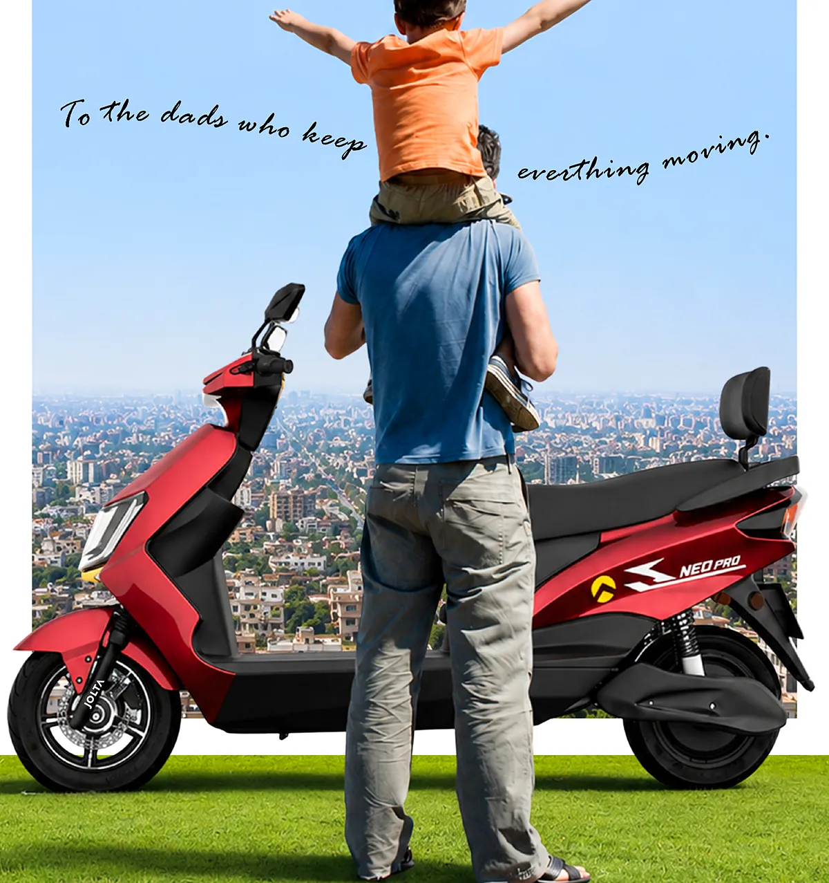 A father carries his son on his shoulders beside a red Jolta Neo Pro, looking over the city