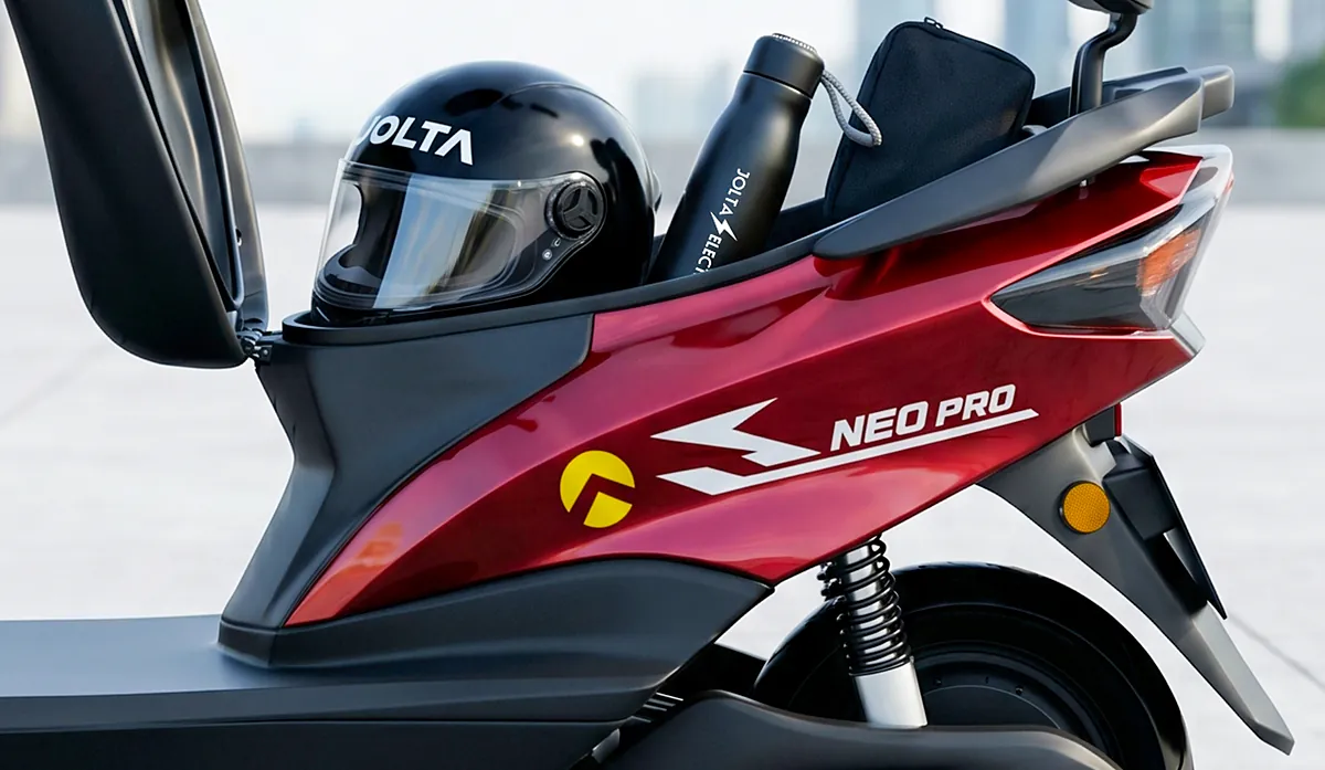 A helmet, water bottle and bag in the open under-seat storage of a red Jolta Neo Pro