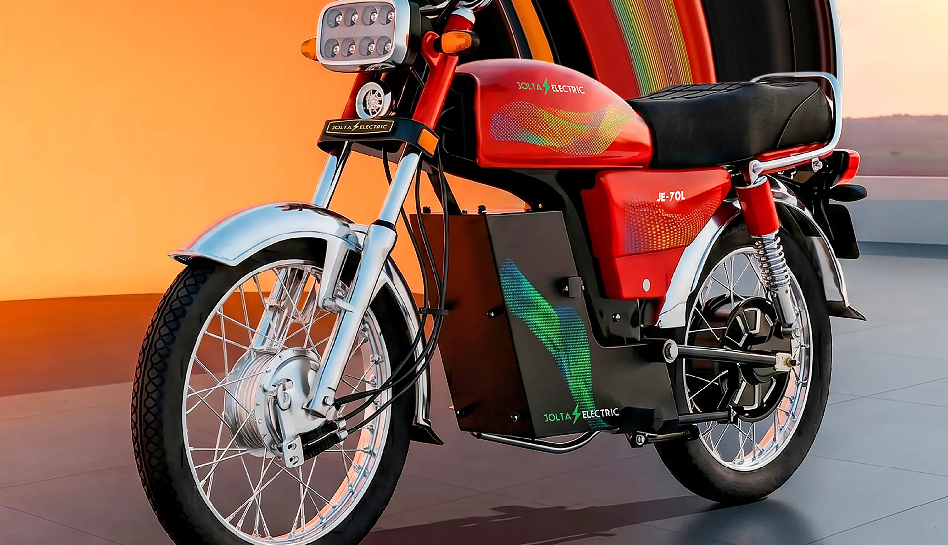 Jolta JE-70L Fury electric motorcycle in red against an orange sunset wall